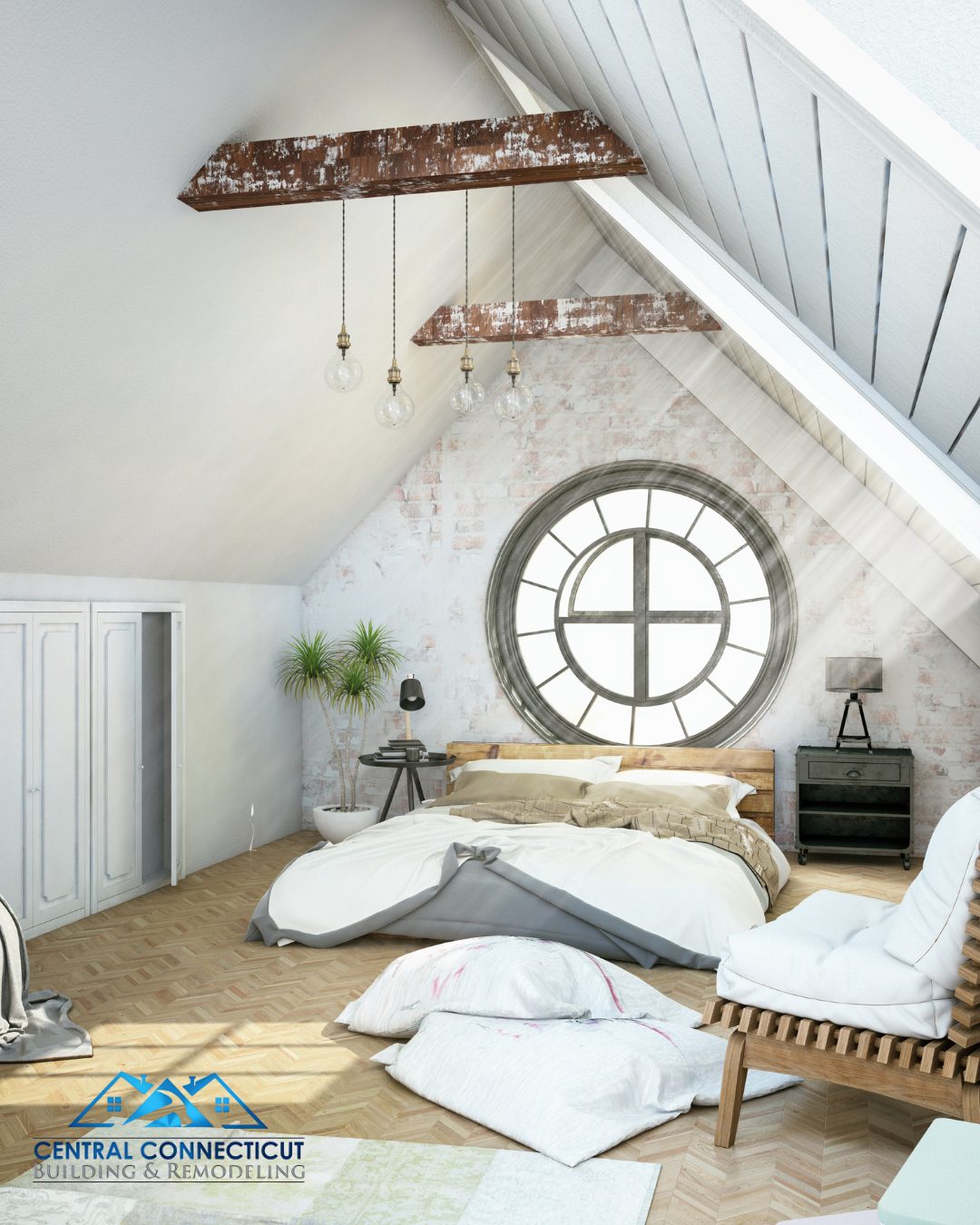 Attic bedroom conversion in Berlin CT with exposed beams, round window, and modern rustic design by Central Connecticut Building and Remodeling.